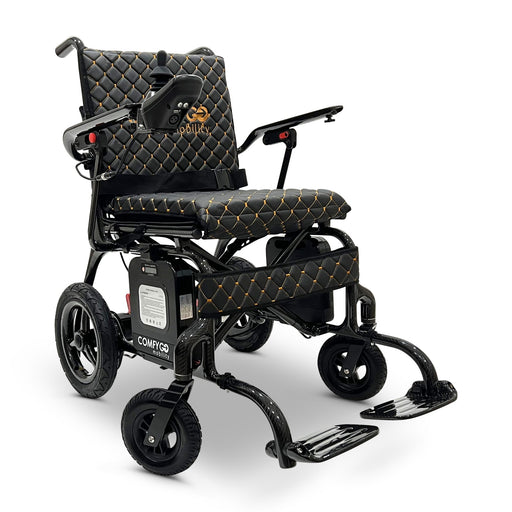 ComfyGo Phoenix carbon fiber folding electric wheelchair, black quilted textile cushion, front three-quarter view