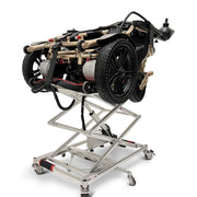 ComfyGO GO-Lift portable lift partly raised with a folded power wheelchair on the platform