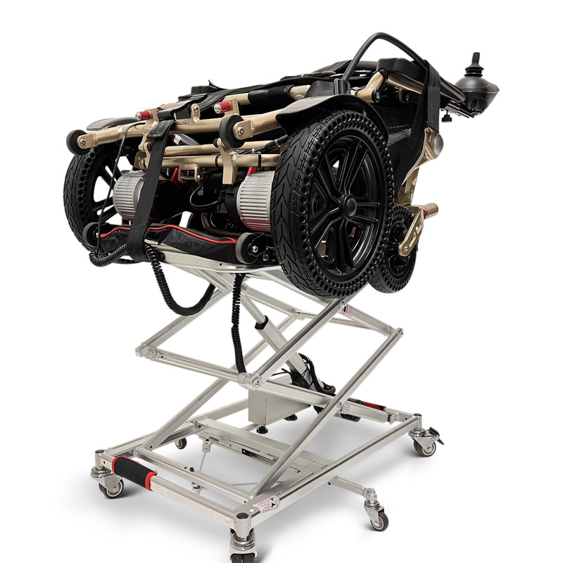 ComfyGO GO-Lift portable lift partly raised with a folded power wheelchair on the platform