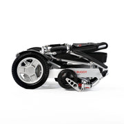 Travel Buggy City 2 Plus power chair, silver, folded for transport
