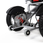 Travel Buggy City 2 Plus power chair, silver, close-up of the rear wheel and anti-tip wheels