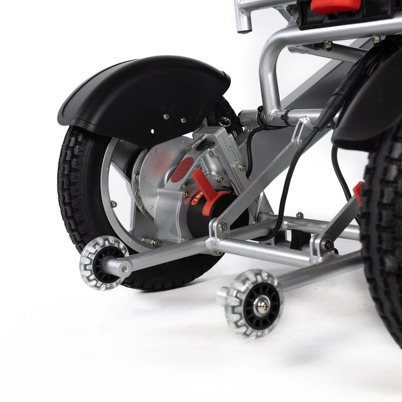 Travel Buggy City 2 Plus power chair, silver, close-up of the rear wheel and anti-tip wheels